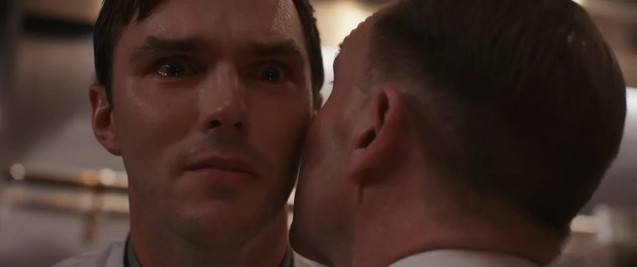 Chef Slowik whispers painful truths to Tyler Ledford during a pivotal scene in The Menu.