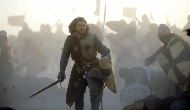 Balian charges into battle during a pivotal war scene.