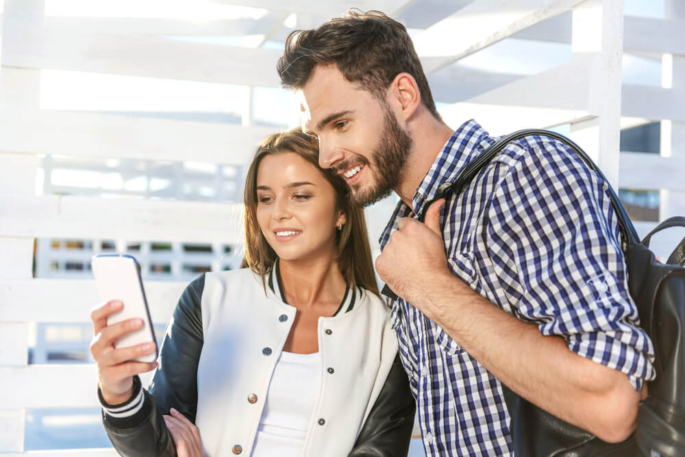 couple looking at smartphone